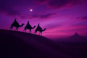 Silhouetted camels and riders against a vibrant, twilight desert sky. photo