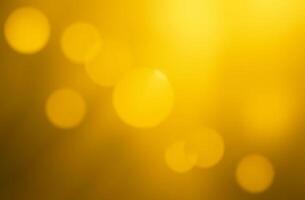 Abstract background round sparkling bokeh lights yellow background photo