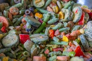 Colorful assortment of frozen vegetables ready for cooking in a kitchen setting photo