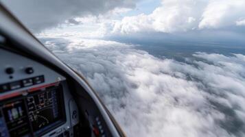 A view from inside a plane looking out at the clouds photo