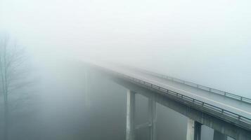 Muted aerial shot of a fog-covered bridge, soft pastel hues, cinematic silence photo