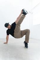 An Exceptional Dynamic Breakdancer Captured in a Powerful Pose, Highlighting Artistry and Elegance photo