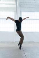 Dynamic and Energetic Dance Movement in a Vibrant Urban Studio Setting with Artistic Flair photo
