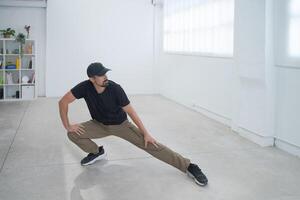 Engaging and Dynamic Dance Moves are Performed in a Minimalistic and Stylish Space with Artistry photo