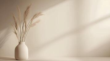 A vase with some grass in front of a window photo