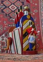 Drummer and the Brave Guards, barrel organ and oriental carpet, bazaar photo