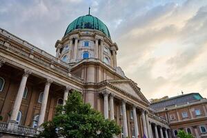 Historic Buda Castle with green dome and ornate columns in Budapest. Architectural landmark of cultural heritage in Hungary photo
