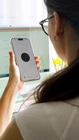 Prague, Czech republic - February 24, 2025. Back view of woman holding Iphone with Chat Gpt application on screen. Work assistant with Open Ai. Artificial Intelligence concept. Vertical . video