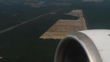 Airplane taking Off. First-person view from the window. Engine and wing in flight. Travel experience video