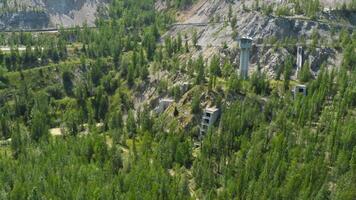 Mountains covered in greenery. Aerial view from the funicular over a forest road video