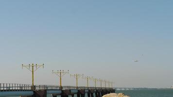 Airport approach lighting system. Runway guidance for landing. ILS with jet aircraft approaching in Hong Kong video