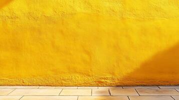 Bright yellow painted wall with a stone tile floor and a subtle shadow adding depth. The scene exudes warmth and simplistic beauty. photo
