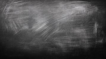 A dark, textured surface with varying shades of gray and white, creating a visually striking abstract background with subtle contrasts. photo