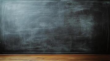 Dark, worn chalkboard with chalk residue and a wooden base. Ideal for education, background, or texture-related creative projects. photo
