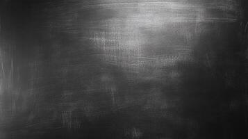 A textured, dark gray surface with subtle streaks of light, creating a visually compelling, abstract pattern. Suitable for backgrounds. photo