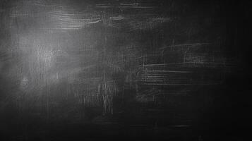 This is a black surface with subtle textures and variations in tone, creating a sense of depth and visual interest. The rough texture is shown. photo