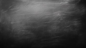 A textured dark surface, reminiscent of a chalkboard or slate, displaying remnants of prior use. Excellent for backgrounds and overlays. photo