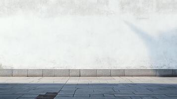 Minimalist urban scene featuring a weathered white wall, gray stone curb, and patterned sidewalk with sunlight creating shadows. photo