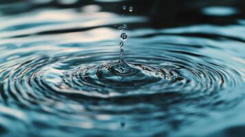 Water drop creating ripples. A mesmerizing moment of liquid meeting liquid, showcasing a perfect balance between motion and stillness. photo