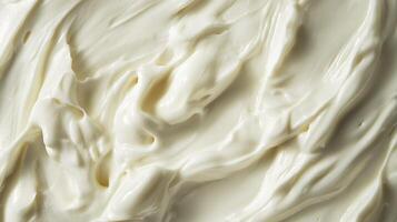 Close-up texture reveals the creamy, smooth surface. The bright white substance creates visual interest with its natural patterns. photo