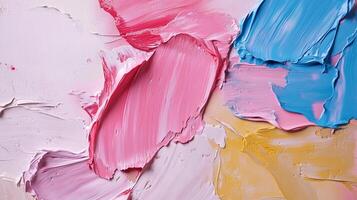 Abstract painting showcasing vibrant texture and hues. A blend of pink, blue, white, and yellow creates a visually appealing artwork. photo
