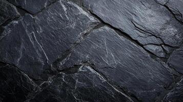 Dark rock texture with diagonal lines creating a striking and dramatic natural stone background. Perfect for adding depth to designs. photo