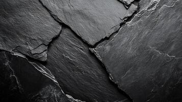 A close-up image of textured slate pieces, highlighting the unique patterns and raw beauty of the natural stone formation. photo