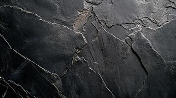 Intricate textures and natural patterns converge in a striking display of dark metamorphic rock, showcasing nature's artistry. photo