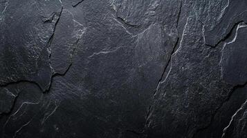 Dark and moody stone texture of rough hewn stone. Surface with a textured pattern formed from the split stone is perfect background. photo
