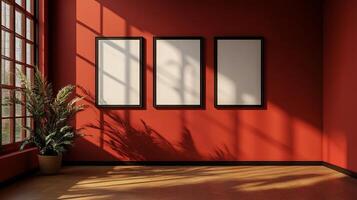 Sunlit room with blank frames on a warm, red wall and a plant casting shadows, creating a tranquil and inviting atmosphere. photo
