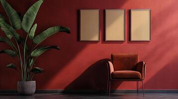 Indoor setting with a red accent wall, a comfortable chair, framed art and a large plant creating a cozy and inviting atmosphere. photo