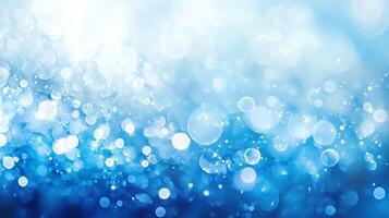 Abstract blue and white light. Defocused bokeh lights of various sizes with a gradient of blue tones. Festive winter background. photo