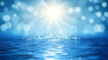 A vibrant sunbeam shines upon the surface of blue water, with sparkling splashes creating a dazzling effect. photo
