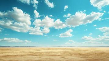Expansive desert landscape stretches to the horizon under a vast blue sky filled with fluffy white clouds, creating a sense of endless space. photo