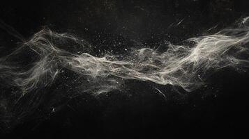 Abstract cloud of particles drifting across a black background, resembling smoke or a nebula, creating ethereal and dreamlike imagery. photo