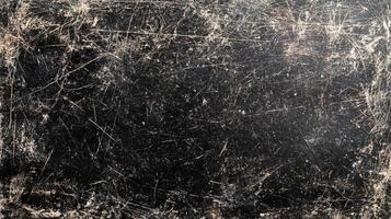 Dark and distressed surface with intricate scratches and worn edges, creating a vintage and textured effect with a unique character. photo
