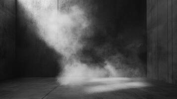 Monochrome image featuring fog or smoke gently swirling in a dimly lit, concrete room, accented by a ray of light breaking through. photo