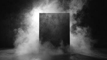 Mysterious monolith shrouded in mist. A dark, square object dominates the scene, surrounded by swirling fog, creating an eerie atmosphere. photo