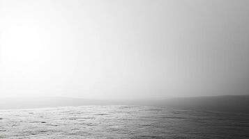 A monochromatic view of a misty landscape offers a mysterious aura, suggesting feelings of nostalgia and ambiguity while delivering a striking visual experience. photo