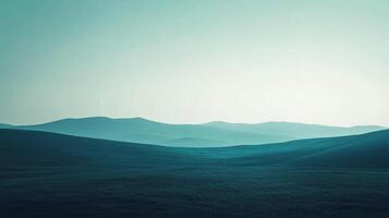 This serene landscape captivates with rolling hills painted in calming teal hues, evoking feelings of tranquility and peace in a vast natural setting. photo