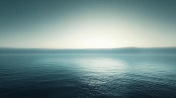 The image captures a calm ocean surface bathed in ethereal light, creating a surreal landscape that evokes feelings of tranquility and deep contemplation of nature's beauty. photo