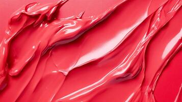 A dynamic and fluid composition of pink paint swirls captured on a vibrant background, emphasizing movement and creativity in artistic expression. photo