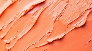 This image presents a creamy orange texture with swirling brush strokes, evoking a sense of warmth and creativity, suitable for artistic projects and backgrounds. photo