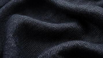 This close-up image presents a detailed view of a dark black textile weave, emphasizing its intricate design and texture, perfect for showcasing fabric quality and craftsmanship. photo