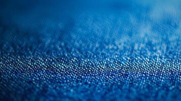 An abstract close-up of blue denim fabric, showcasing intricate textures and patterns that convey a sense of depth and tactile richness, ideal for fashion themes. photo