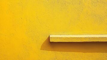 A striking shot of a bright yellow wall featuring a horizontal beam, accentuated by the interplay of light and shadows that create visual interest. photo