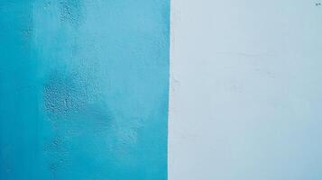A split-toned wall displays striking blue shades with abstract textures that create a unique visual interest and can enhance any modern space with its artistry. photo