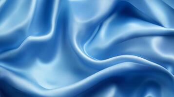 A striking blue satin fabric that showcases a luxurious flowing texture, presenting an ideal choice for exquisite fashion details and artistic visual compositions in photography. photo