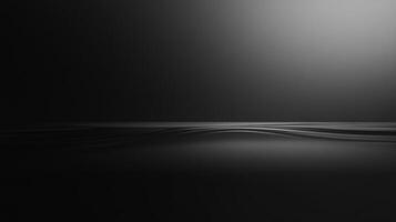 This image showcases smooth black waves that stretch across the horizon with soft light illuminating the surface, creating a serene and contemplative atmosphere. photo