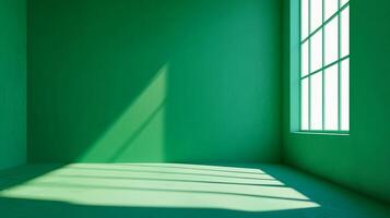 An empty green room with a window and light streaming through, casting shadows and creating a sense of space and calmness. Simplicity. photo